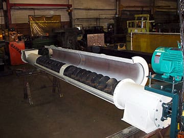 Screw Conveyors Screw Conveyors in white housing with green motor