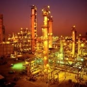 Night Photo of a Petrochemical Plant with pipes and conveyors